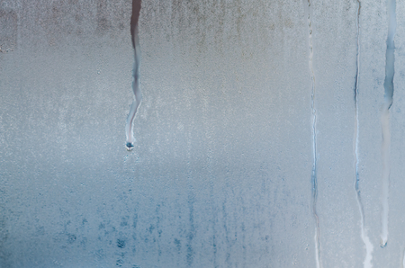 Water droplets condensation background of dew on glass window, humidity and foggy blank close up view. Outside the window, bad raining weather concept.の写真素材