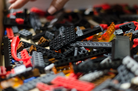 Colored toy bricks for kids texture background. Playing and building with plastic toy bricks concept. Pieces and elements of constructor toys. Be creative and different.の写真素材