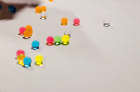 Colored balls of hydrogel isolated on the white background. Growing water balls close up view.の写真素材