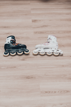 Black and white roller skates for a couple close up view. Ready to skate on the roller rink concept.