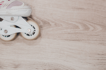 White roller skates on the roller rink. Wheels close up view. Ready to skate concept.