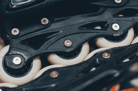 Black roller skates on the roller rink. Wheels close up view. Ready to skate concept.の写真素材