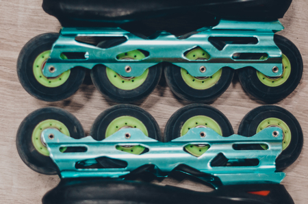 Black old roller skates on the roller rink. Wheels close up view. Ready to skate concept.の写真素材