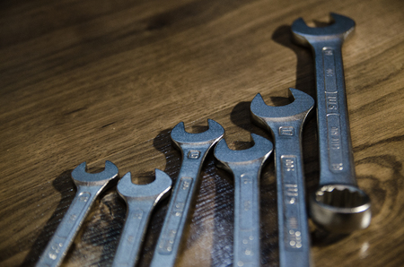 hand tool complete set the wrench of different sizes. Hex wrench on wood background. Collection of...
