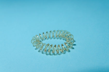 round elastic scrunchy for female hairstyle with empty space for text. White hair band on blue...