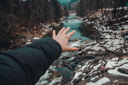 river in the mountains of bukovel with swirling stream of water. Big boulders in mountain creek...