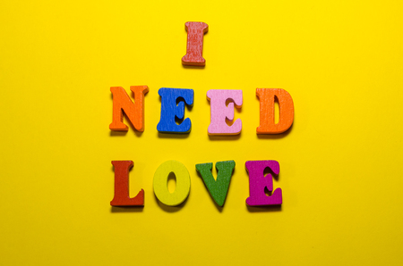 i need love written with wooden colored lettersの写真素材