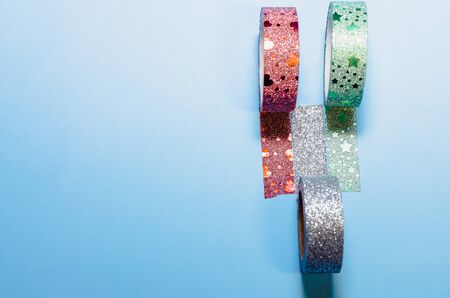 colorful washi tapes isolated on blue background from top viewの写真素材
