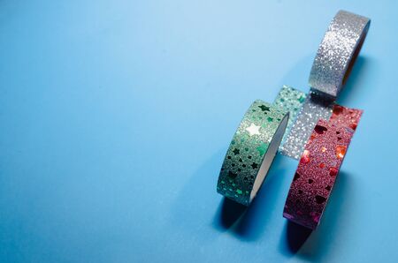 colorful washi tapes isolated on blue background from top viewの写真素材