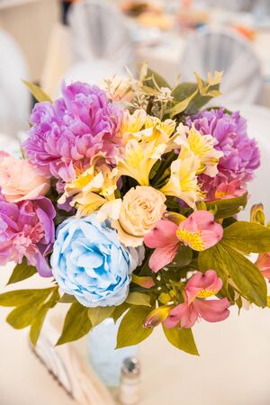 flowers as decor on table at the restaurant from the top viewの写真素材