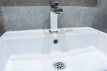 black and white photo of close up view of the sink in the bathroomの写真素材