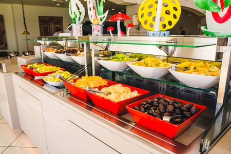 different dishes in buffet table in the hotel dinning roomの写真素材