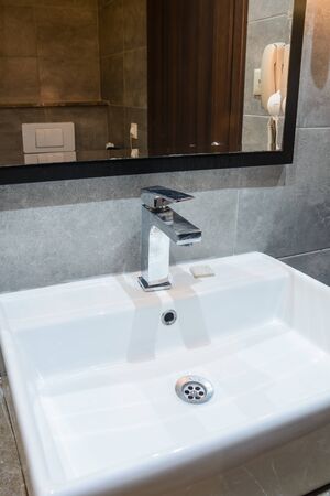 close up view of the sink and window in the bathroomの写真素材