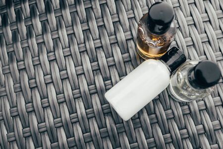 shower gel, shampoo and body lotion in small tubes. travel bottle set mock upの写真素材