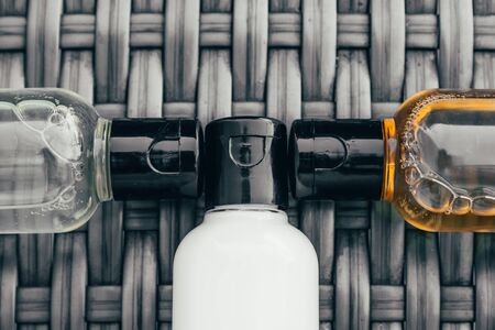 shower gel, shampoo and body lotion in small tubes. travel bottle set mock upの写真素材