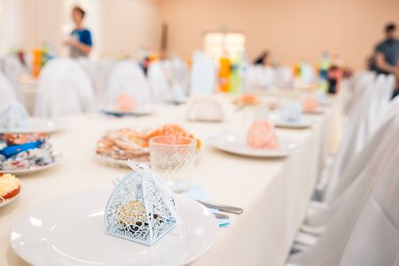 served tables at the wedding with cutlery and fresh dishes. banquet conceptの写真素材