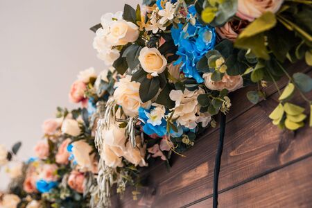 flowers on wooden wall as hall decorの写真素材