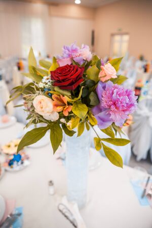 flowers on served tables at the wedding. banquet conceptの写真素材