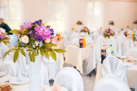 flowers on served tables at the wedding. banquet conceptの写真素材
