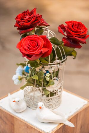 red roses in cage. wedding decorの写真素材