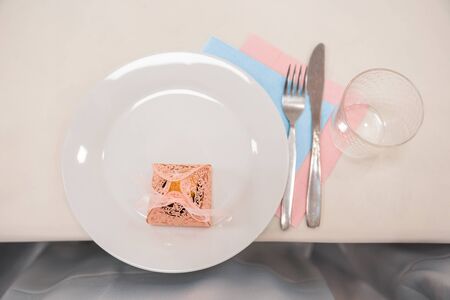 service set of cutlery, glass cup and dish on the tableの写真素材