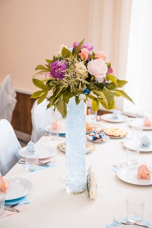 flowers on served wedding tables. banquet decor conceptの写真素材