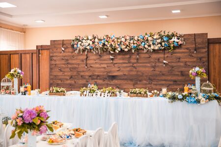 bride and grooms table in the hall where is written loveの写真素材