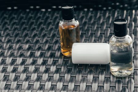close up view of shower gel, shampoo and body lotion in small travel tubes in hotel bathroomの写真素材