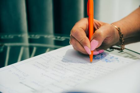 woman signing a document on the table. business agreementの写真素材