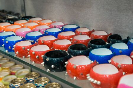 salling different bijouterie in the shop. bracelets with spikesの写真素材