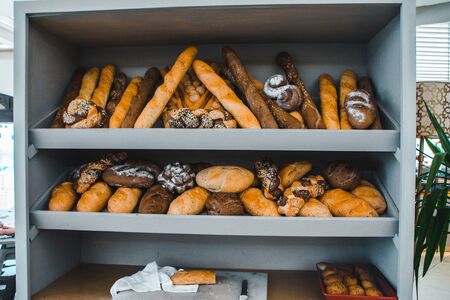 shelves with bread in the supermarket.  variety of bakery productsの写真素材