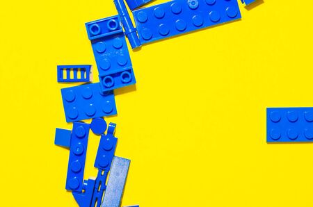 making a circle from colorful toy bricks. developing children game to distinguish colors and build geometric shapesの写真素材