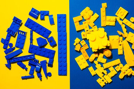 contrast of yellow and blue toy bricks for kids.color difference game. Playing in plastic constructor conceptの写真素材