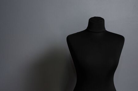 Empty black mannequin on grey isolated background. fashion design studioの写真素材