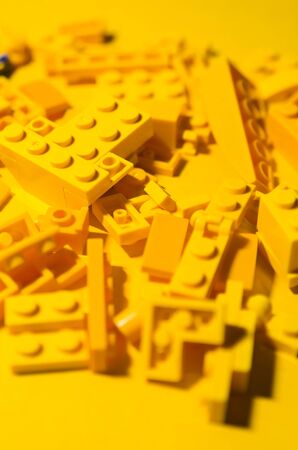 yellow constructor pieces on yellow background. educational game for children to distinguish colorsの写真素材