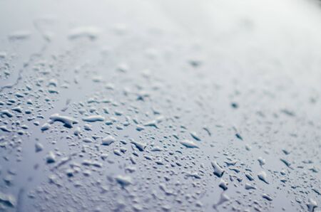 raindrops on the car. rainy weather in autumn seasonの写真素材