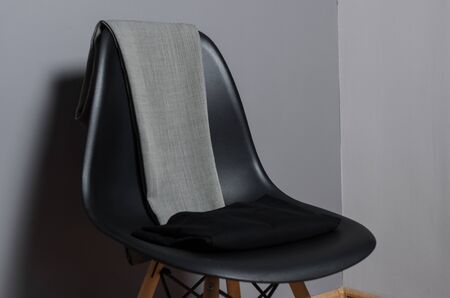 black chair with classic pans in design clothes studio