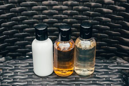 close up view of shower gel, shampoo and body lotion in small travel tubes in hotel bathroomの写真素材