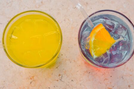 two cooling drinks with ice cubes from the top view.の写真素材