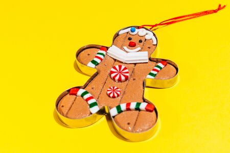christmas tree toy ginger cookie. gingerman is smiling and is happy for christmas to come