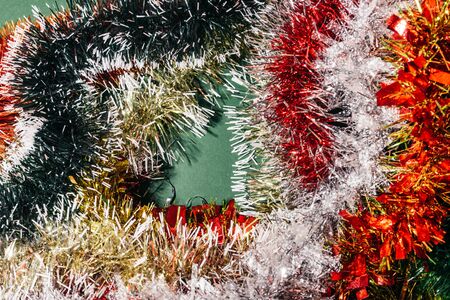 texture background of flat lay christmas colorful tinsel. it is that time of the year to sparkleの写真素材