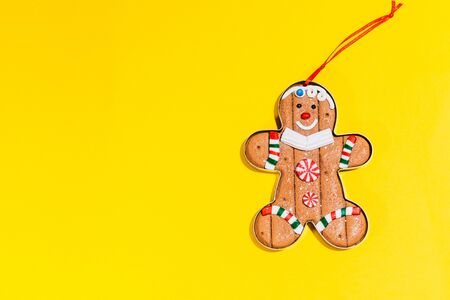 christmas tree toy ginger cookie on isolated background. gingerman is smiling and is happy for christmas to come from top viewの写真素材