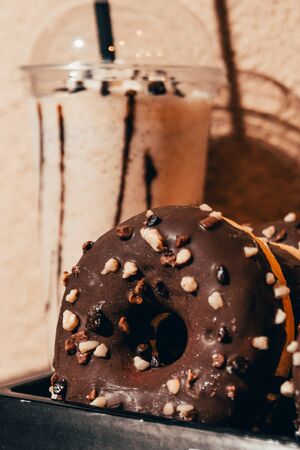 close up view of chocolate donut with frappe. chocolate breakfast conceptの写真素材