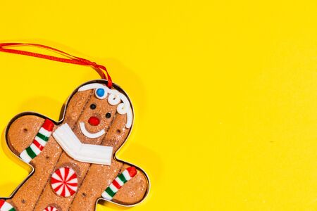 christmas tree toy ginger cookie. gingerman is smiling and is happy for christmas to comeの写真素材