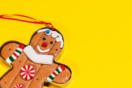 christmas tree toy ginger cookie. gingerman is smiling and is happy for christmas to comeの写真素材