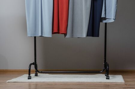 new stylish dress collection on the hangers of clothing rack rails. fashion design studioの写真素材