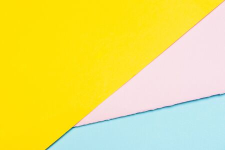 colorful papers texture background. yellow pink and blue partsの写真素材
