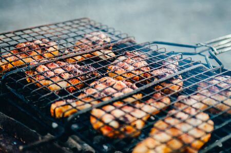 top view of frying chicken meat  on the brazier with foam coming upの写真素材
