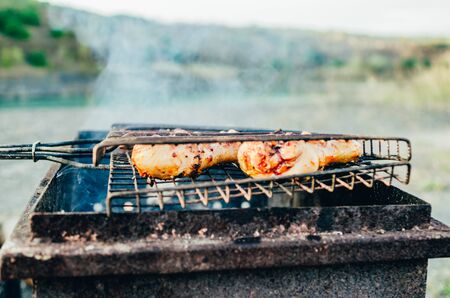 crop view of frying chicken breast on the brazierの写真素材