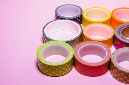 colorful washi tapes isolated on pink background. Feminine stationeryの写真素材